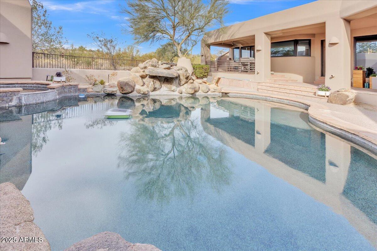 10040 East Happy Valley Road, Unit 300 Scottsdale, AZ 85255 - Photo 49 of 92 Pool, spa, and waterfall