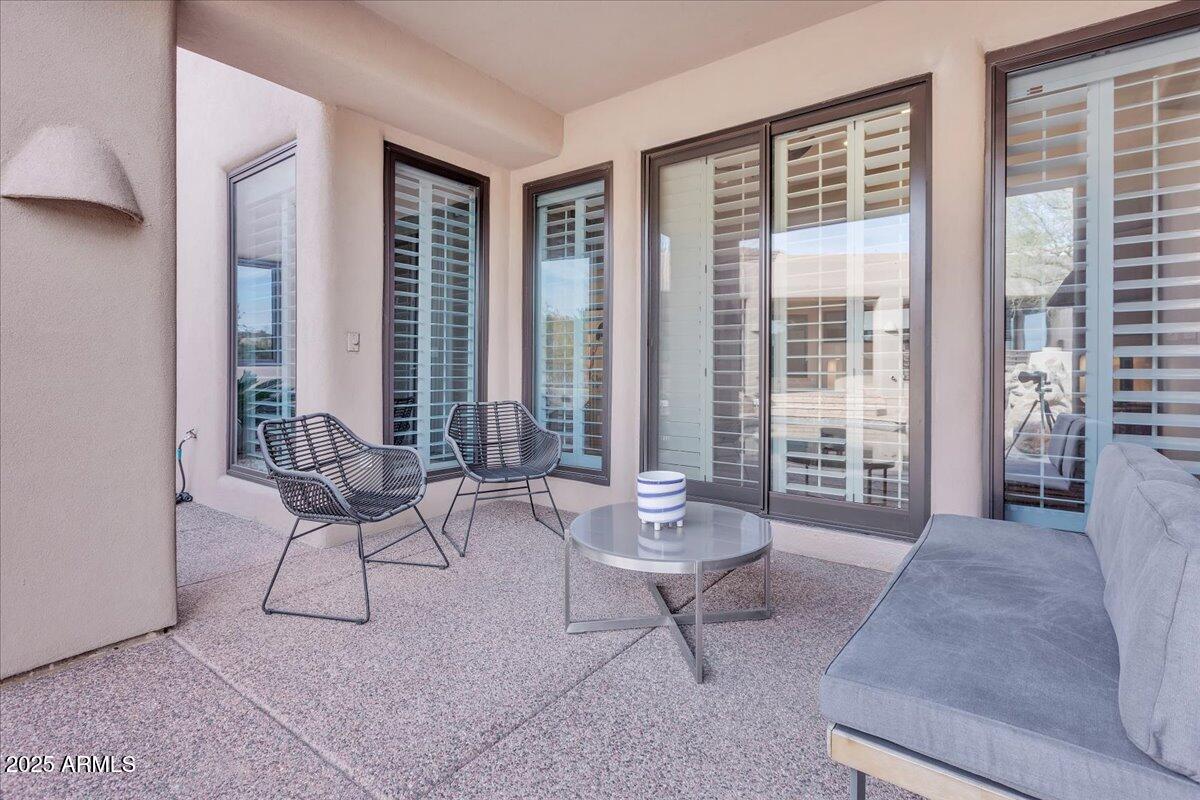 10040 East Happy Valley Road, Unit 300 Scottsdale, AZ 85255 - Photo 50 of 92 a living room with furniture and a large window