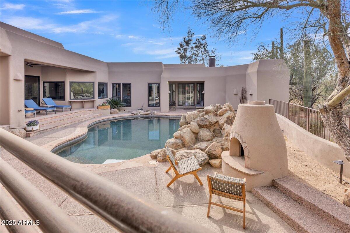 10040 East Happy Valley Road, Unit 300 Scottsdale, AZ 85255 - Photo 55 of 92 a view of a livingroom with furniture and chandelier