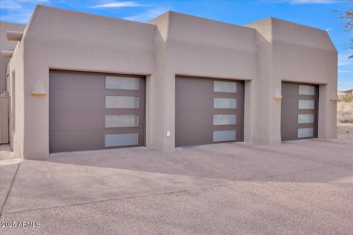10040 East Happy Valley Road, Unit 300 Scottsdale, AZ 85255 - Photo 57 of 92 Cool new doors for 3 Car Garage