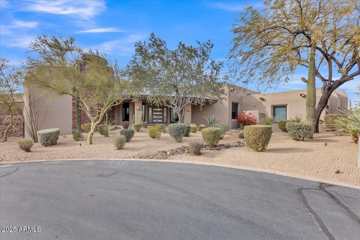 10040 East Happy Valley Road, Unit 300 Scottsdale, AZ 85255 - Photo 59 of 92 a view of a house with a snow in the yard