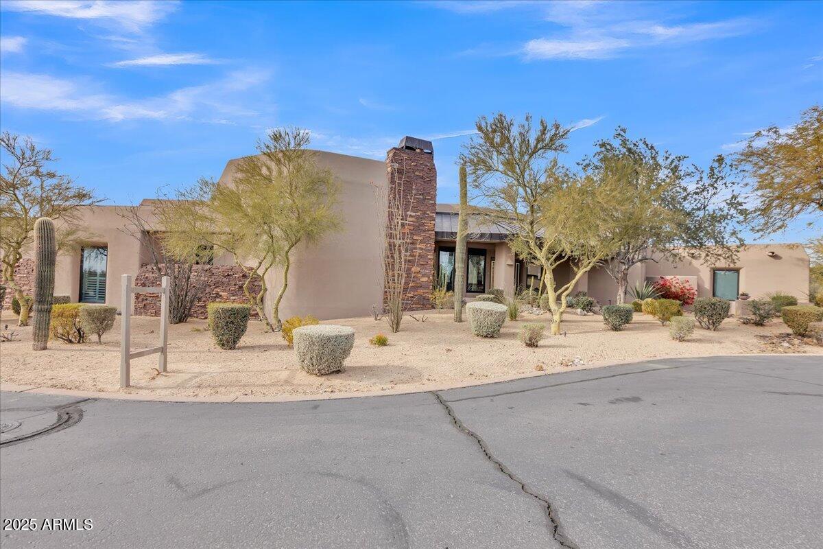 10040 East Happy Valley Road, Unit 300 Scottsdale, AZ 85255 - Photo 71 of 92 a view of a house with a snow on the road