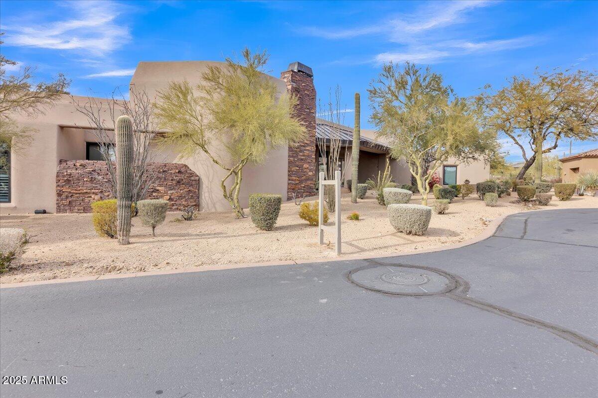 10040 East Happy Valley Road, Unit 300 Scottsdale, AZ 85255 - Photo 72 of 92 a view of a house with snow on the road