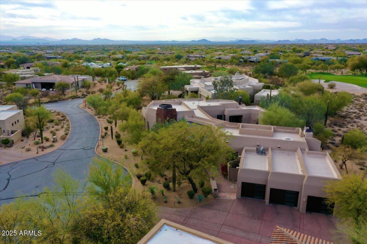 10040 East Happy Valley Road, Unit 300 Scottsdale, AZ 85255 - Photo 76 of 92 an aerial view of a house with a lake view