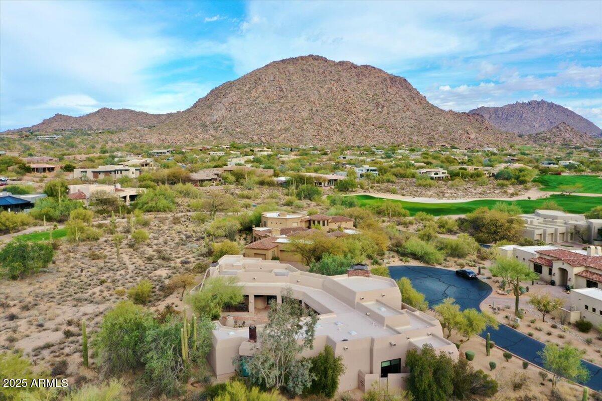 10040 East Happy Valley Road, Unit 300 Scottsdale, AZ 85255 - Photo 81 of 92 an aerial view of residential houses with outdoor space and trees