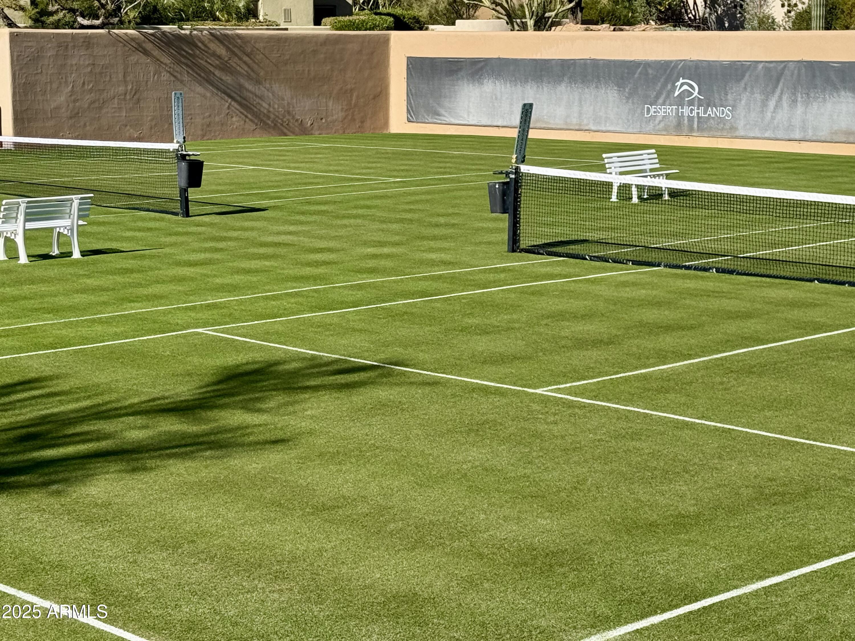 10040 East Happy Valley Road, Unit 300 Scottsdale, AZ 85255 - Photo 88 of 92 two of six grass tennis courts within DH