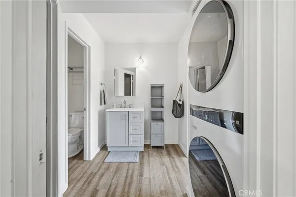 a view of bathroom with a sink and a mirror