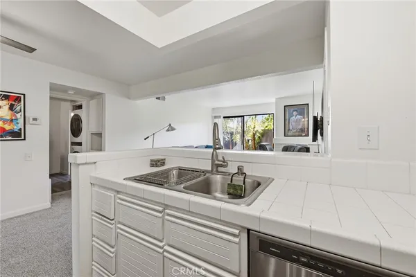 a kitchen with a sink and cabinets