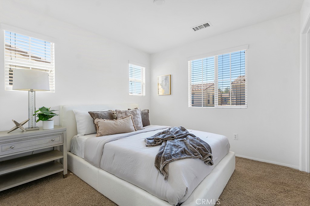 20317 Livorno Porter Ranch Porter Ranch, CA 91326 - Photo 21 of 33 a bedroom with bed and a window