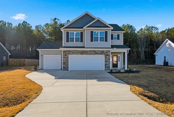 a front view of a house with yard