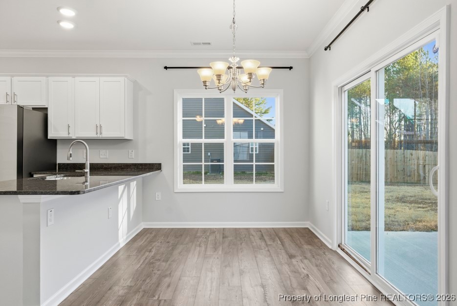 106 Knotts Berry Road Bunnlevel, NC 28323 - Photo 13 of 50 a kitchen with a sink stove and refrigerator