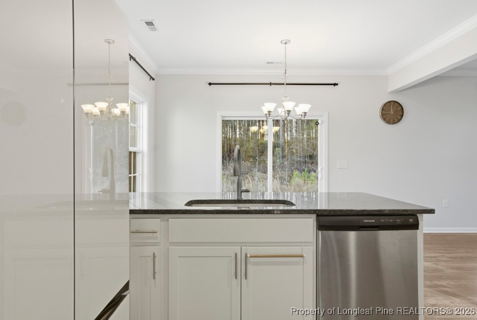 106 Knotts Berry Road Bunnlevel, NC 28323 - Photo 22 of 50 a kitchen with a refrigerator and a sink