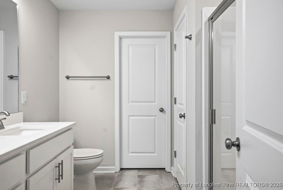 106 Knotts Berry Road Bunnlevel, NC 28323 - Photo 27 of 50 a bathroom with a sink a toilet and shower