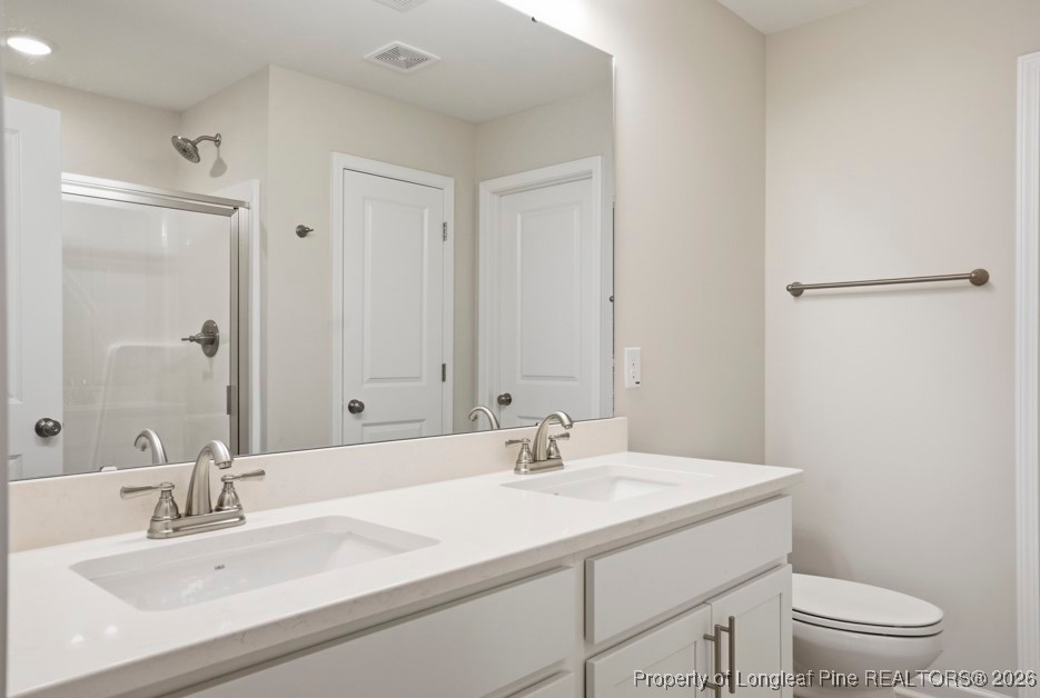 106 Knotts Berry Road Bunnlevel, NC 28323 - Photo 28 of 50 a bathroom with a sink toilet and shower