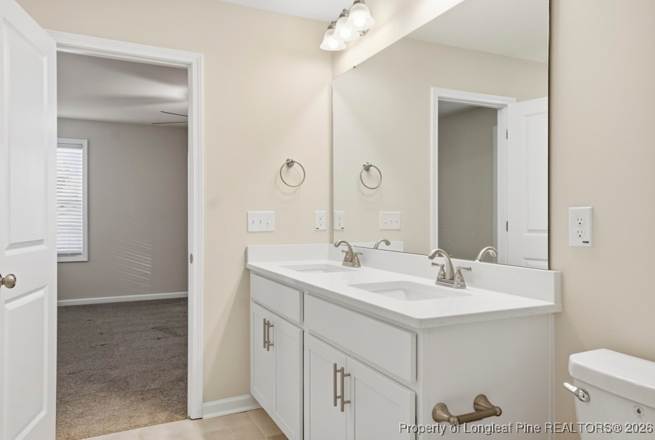 106 Knotts Berry Road Bunnlevel, NC 28323 - Photo 29 of 50 a bathroom with a sink and a mirror