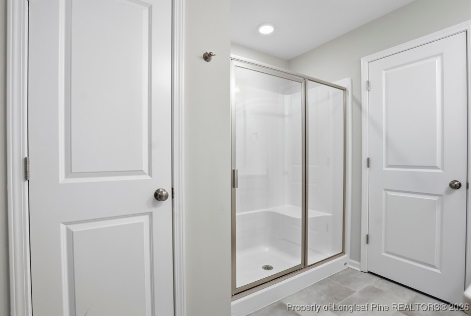 106 Knotts Berry Road Bunnlevel, NC 28323 - Photo 30 of 50 a bathroom with a glass shower door