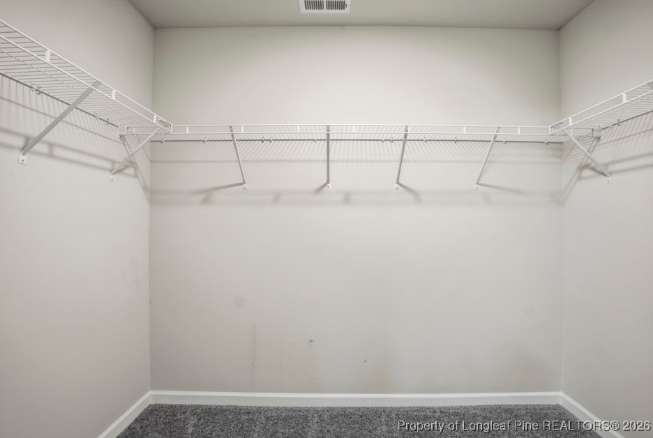 106 Knotts Berry Road Bunnlevel, NC 28323 - Photo 32 of 50 a view of a room with racks on the wall