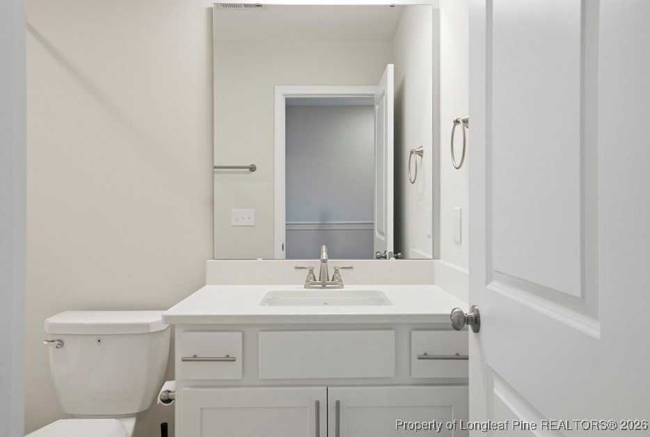 106 Knotts Berry Road Bunnlevel, NC 28323 - Photo 40 of 50 a bathroom with a sink toilet and vanity