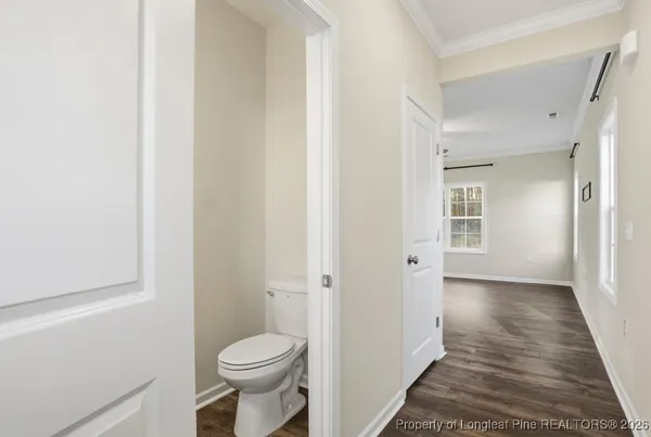 a bathroom with a toilet and a sink