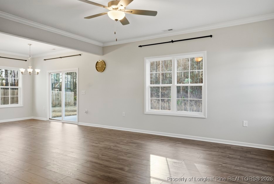 106 Knotts Berry Road Bunnlevel, NC 28323 - Photo 9 of 50 an empty room with wooden floor and windows
