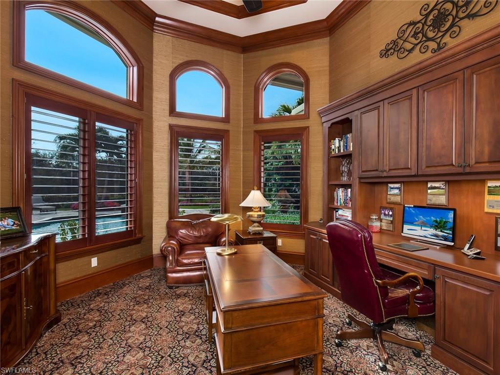 29170 Marcello Way Naples, FL 34110 - Photo 12 of 21 a living room with furniture a window and potted plants