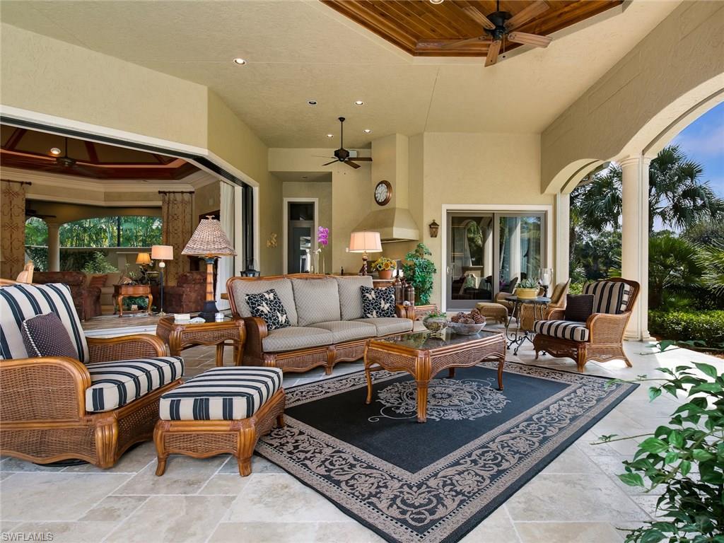29170 Marcello Way Naples, FL 34110 - Photo 14 of 21 a living room with lots of furniture and a rug