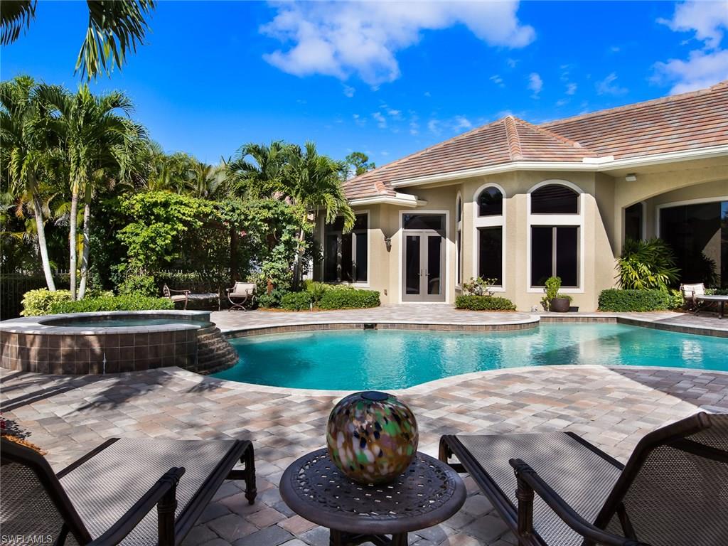 29170 Marcello Way Naples, FL 34110 - Photo 19 of 21 a view of a house with pool and a yard