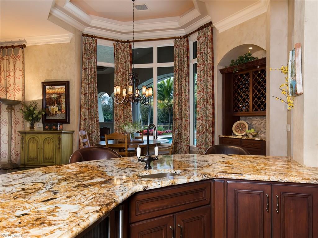 29170 Marcello Way Naples, FL 34110 - Photo 6 of 21 a bathroom with a granite countertop sink and a mirror
