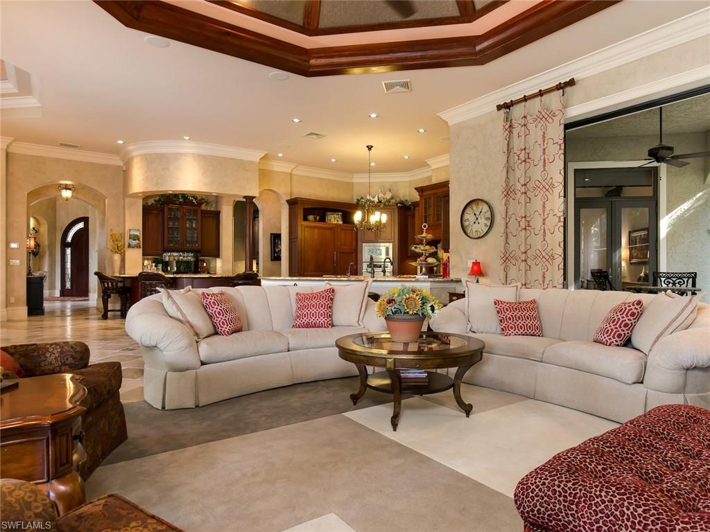 29170 Marcello Way Naples, FL 34110 - Photo 9 of 21 a living room with furniture and a large mirror