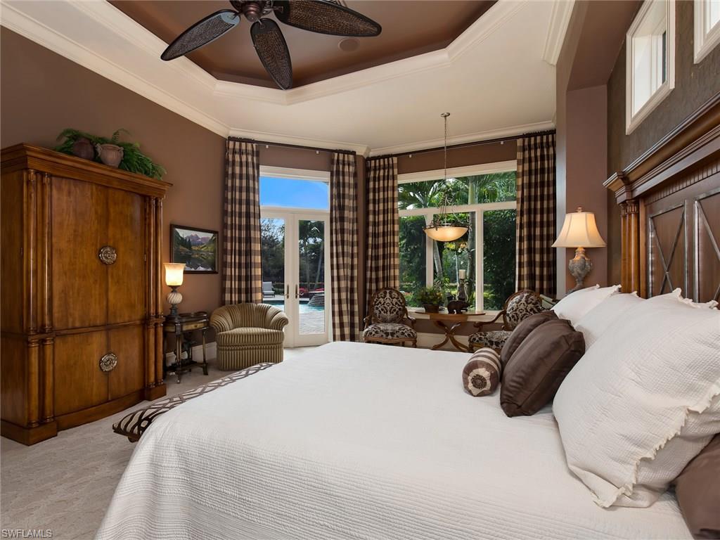 29170 Marcello Way Naples, FL 34110 - Photo 10 of 21 a bed room with a bed and a large window