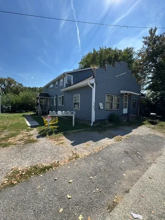 a view of a house with a yard