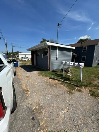 a view of a backyard of the house