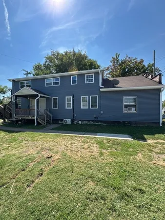 an aerial view of a house with a garden
