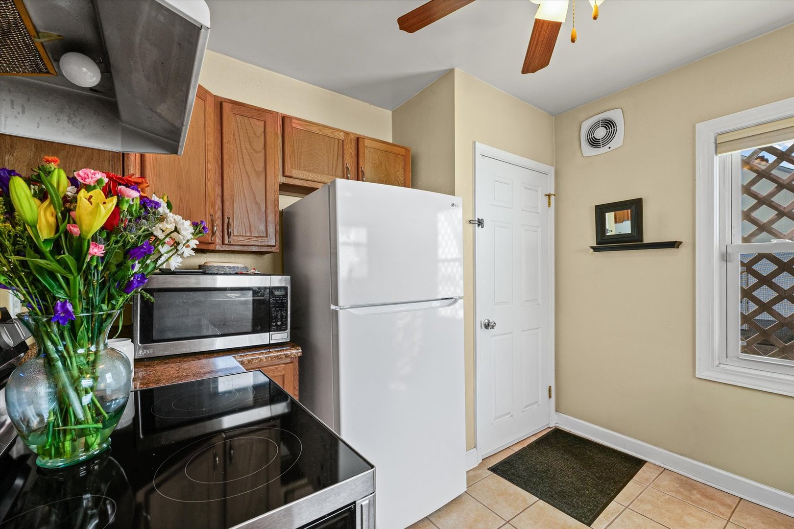 1608 West Springfield Avenue Champaign, IL 61821 - Photo 13 of 36 a white refrigerator freezer sitting inside of a kitchen