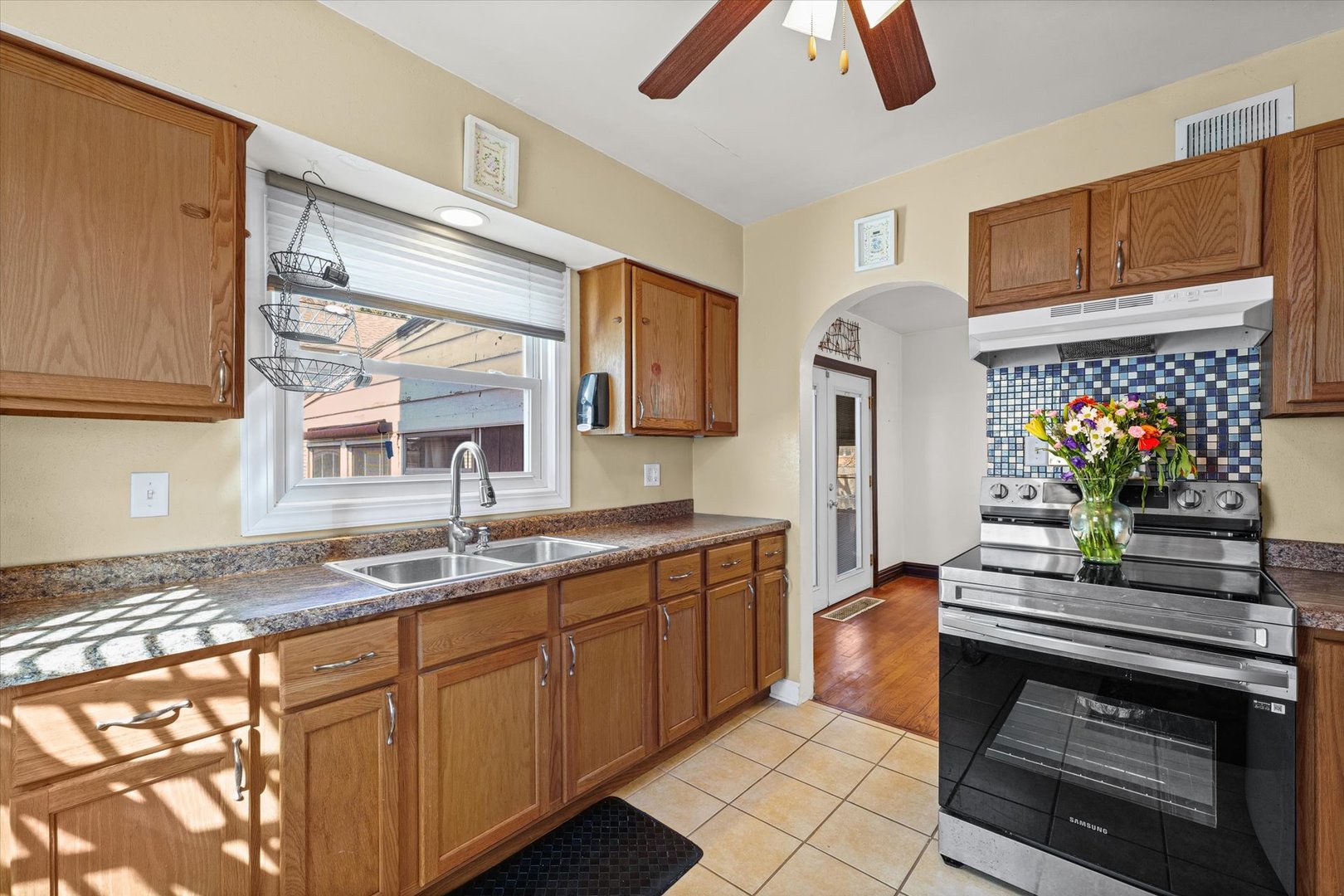 1608 West Springfield Avenue Champaign, IL 61821 - Photo 14 of 36 a kitchen with stainless steel appliances granite countertop a sink and cabinets