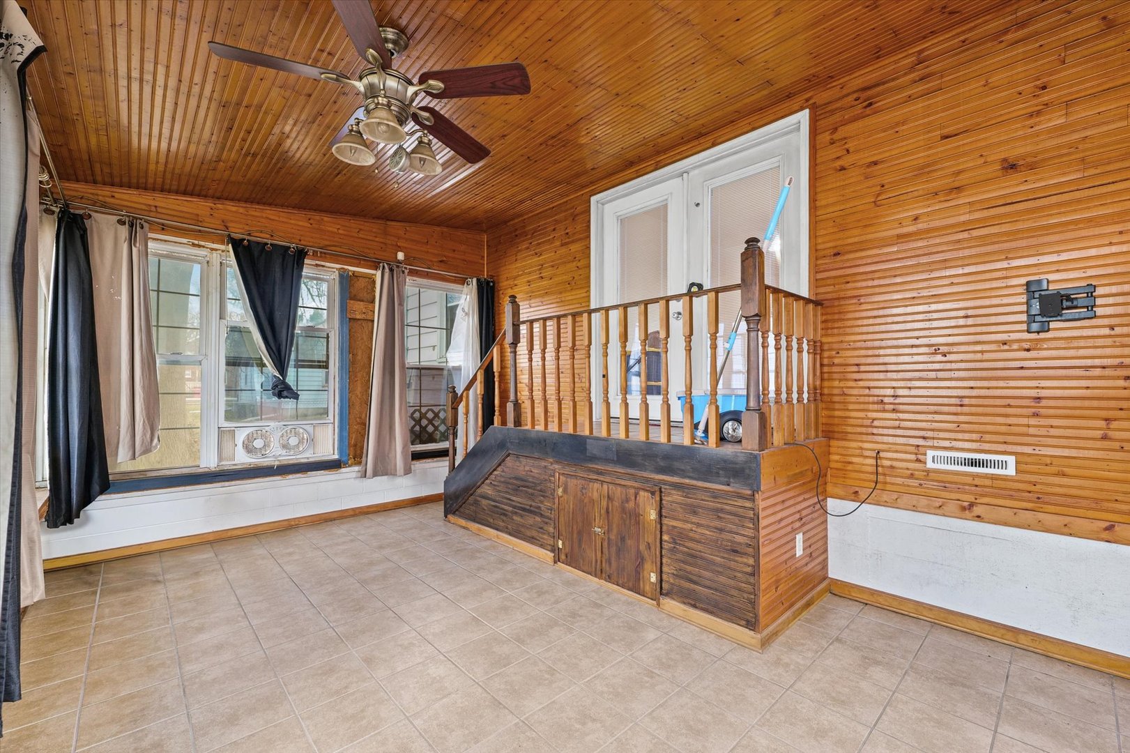 1608 West Springfield Avenue Champaign, IL 61821 - Photo 21 of 36 a view of porch with furniture and a chandelier