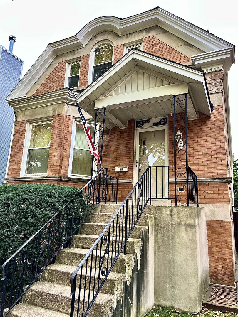 a view of a house with entrance and windows