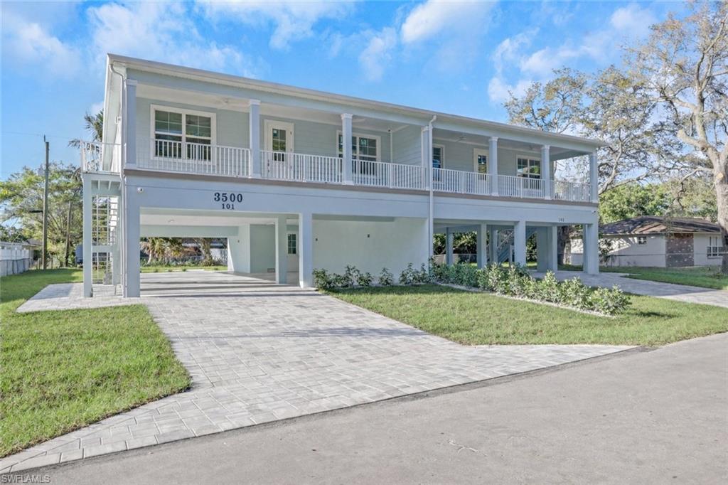 3500 Croton Road, Unit 101 Naples, FL 34104 - Photo 1 of 27 front view of a house with a yard