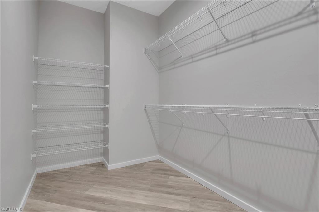 3500 Croton Road, Unit 101 Naples, FL 34104 - Photo 14 of 27 a view of walk in closet with empty racks
