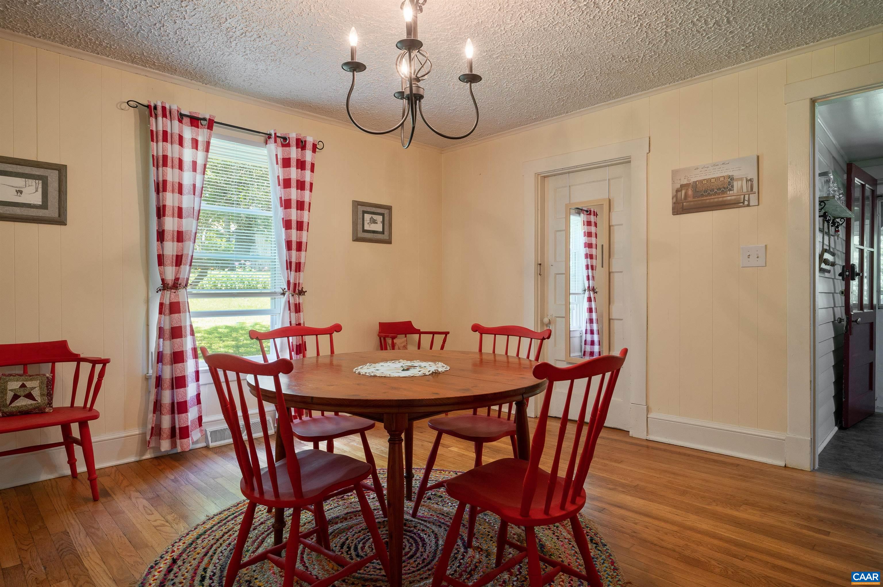 6721 Foster Ridge Charlottesville, VA 22903 - Photo 34 of 45 a view of a dining room with furniture window and wooden floor