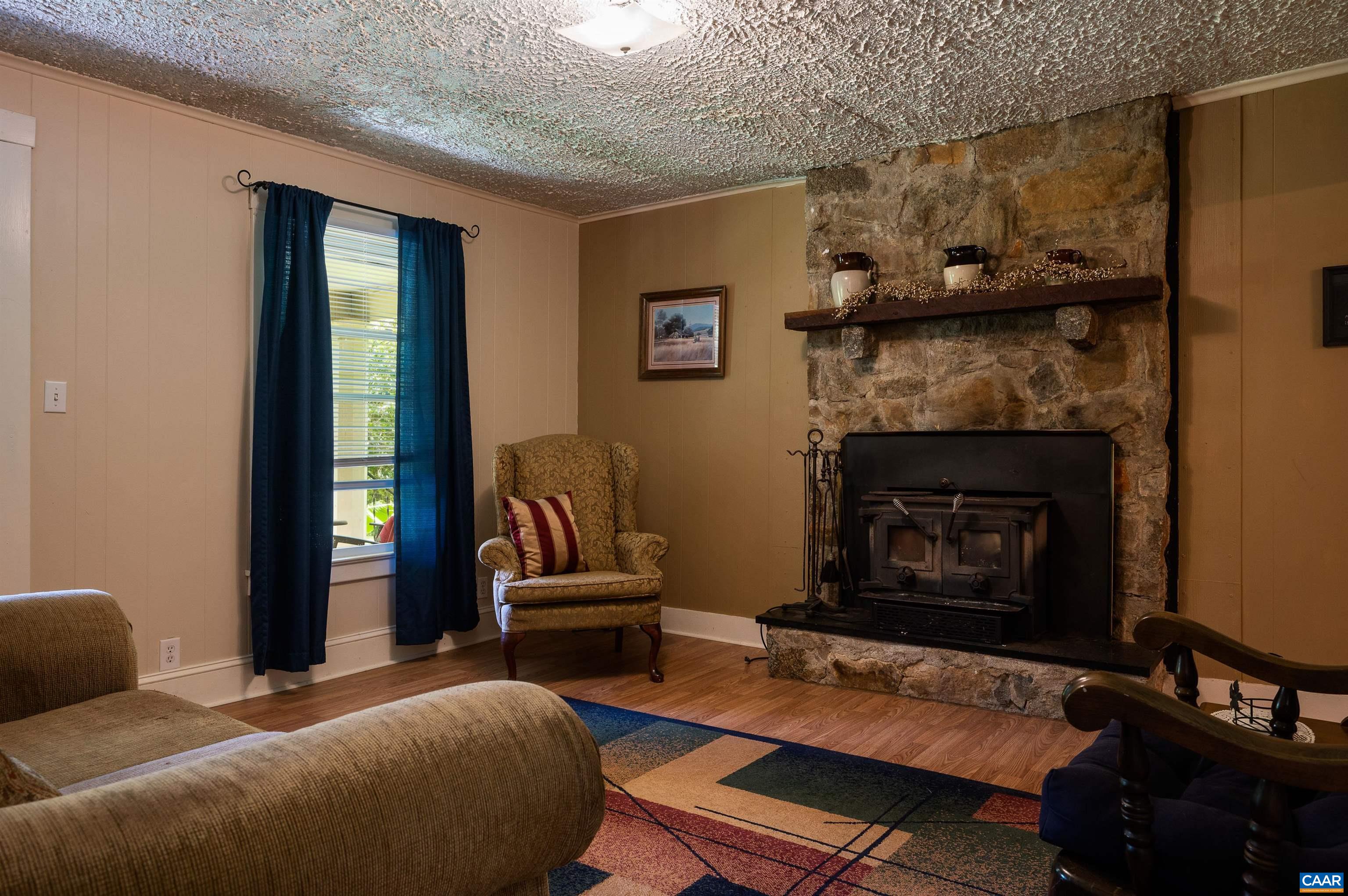 6721 Foster Ridge Charlottesville, VA 22903 - Photo 35 of 45 a bedroom with furniture and a fireplace