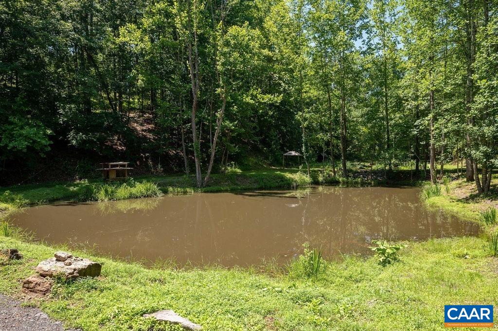 6721 Foster Ridge Charlottesville, VA 22903 - Photo 39 of 45 a view of a lake with a yard