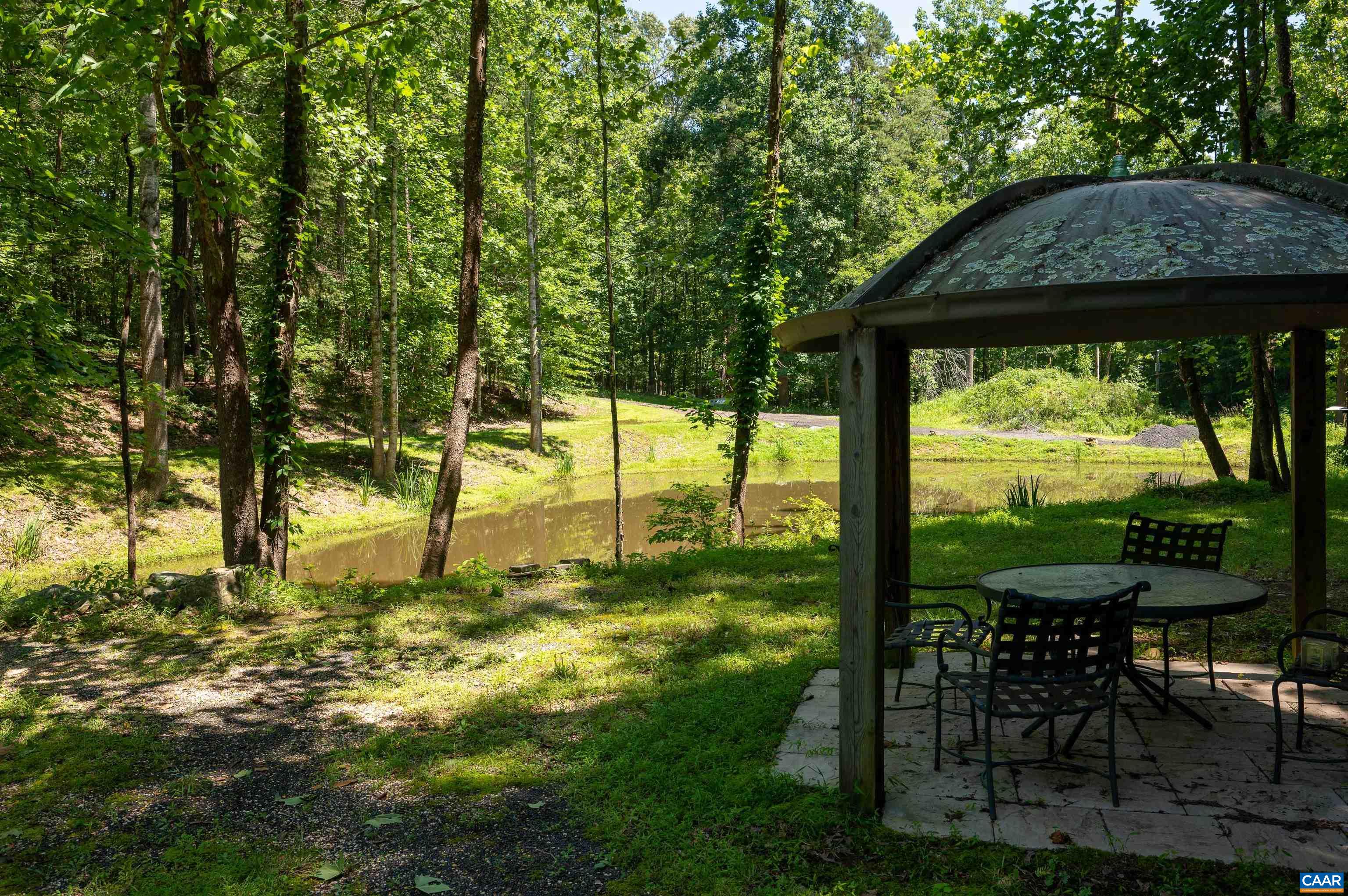 6721 Foster Ridge Charlottesville, VA 22903 - Photo 42 of 45 a backyard of a house with table and chairs