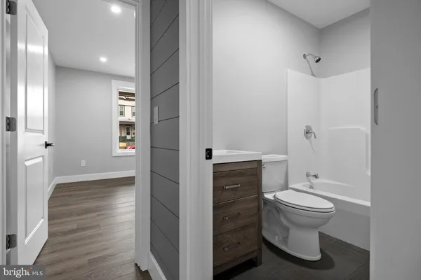 a bathroom with a toilet a sink and shower