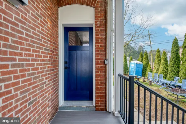 a view of a brick house with a street