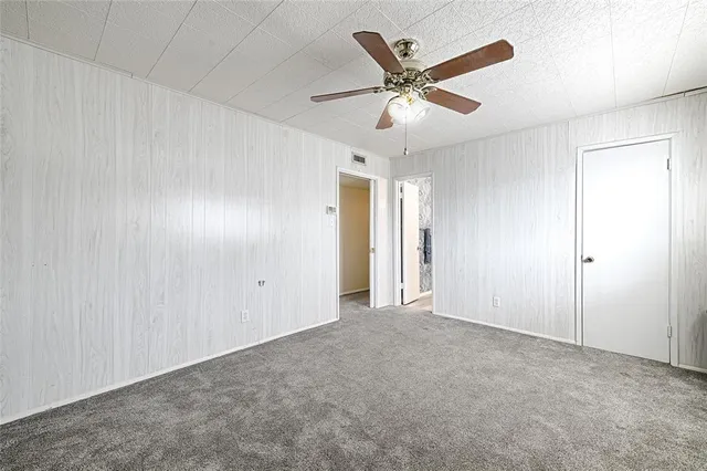 a view of a backyard with a patio and outdoor seating