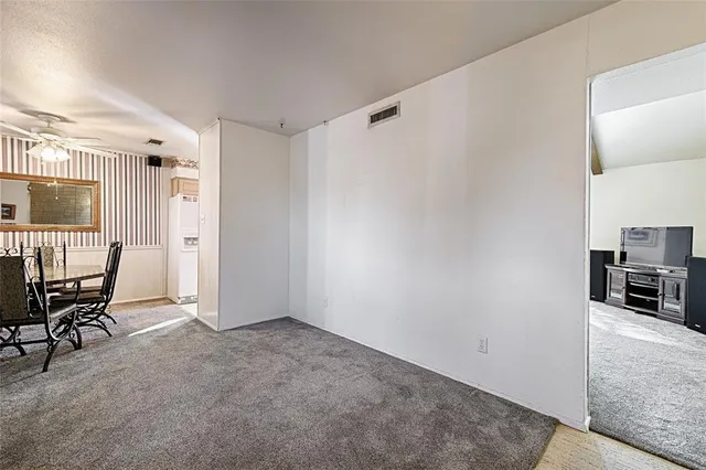 a view of a livingroom with furniture and a window