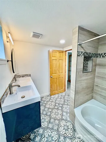 a bathroom with a sink and a mirror