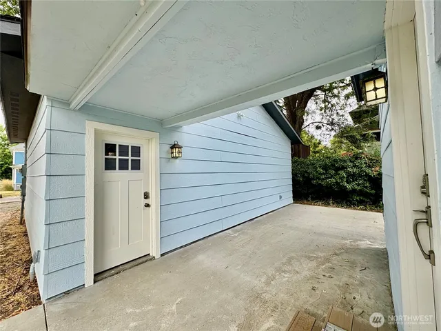 a front view of a house with a garden and yard