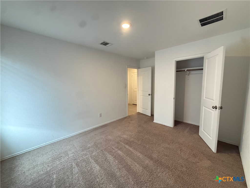 5863 Coahulia Ridge Seguin, TX 78155 - Photo 10 of 15 an empty room with closet area